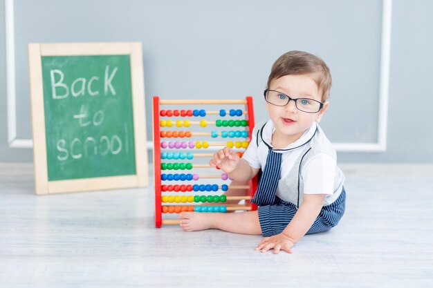 baby-with-glasses-blackboard-that-says-soon-school-is-sitting-with-bills_267293-7374 inTop 10 "puzzle games 2024"